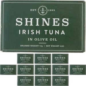 A large green box labelled "12 Box Shines Wild Irish Tuna in Olive Oil - 111g" is displayed above twelve matching tins, each featuring the same branding and weight.