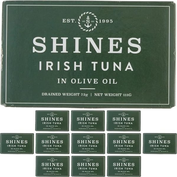 A large green box labelled "12 Box Shines Wild Irish Tuna in Olive Oil - 111g" is displayed above twelve matching tins, each featuring the same branding and weight.