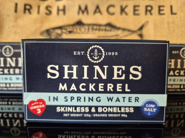 A 125g box of Mackerel Fillets in Spring Water - Low Salt, skinless and boneless, high in Omega 3. Features an illustration of a fish and “Irish Mackerel” in the background.