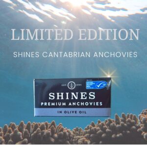 A 50g tin of anchovies from the Cantabrian Sea is shown underwater above coral with sunlight streaming down. Text reads: “Limited Edition: Anchovies from Cantabrian Sea.”.