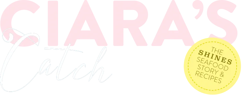 Logo with large pink text reading "CIARA'S", silver script "Catch" beneath, and a yellow circle on the right with the words "THE SHINES SEAFOOD STORY & RECIPES" inside.